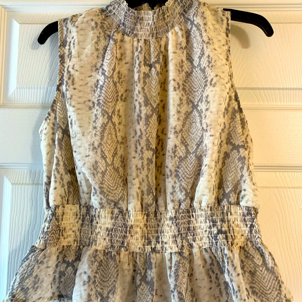 Gorgeous snake print peplum top! New without tags!